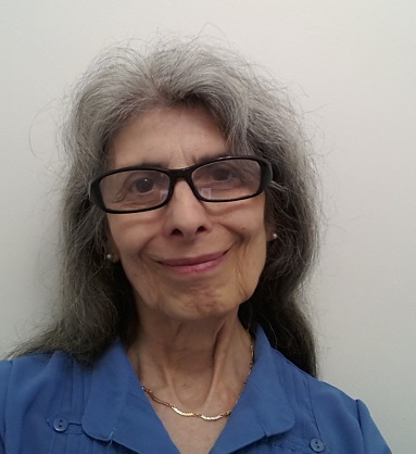 Head photo of Susan smiling wearing my horn rimmed glasses